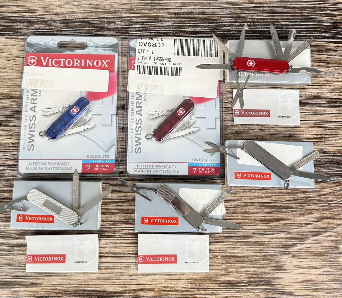 Collection of Victorinox Swiss Army Pocket Knives: Nice grouping in various colors. Model numbers are 53709, 53972, 53709, 54709. New in boxes