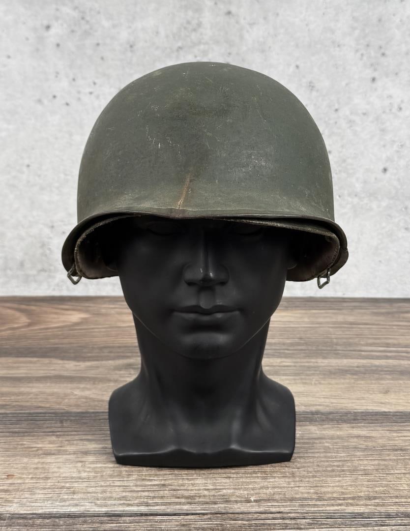 Korean Vietnam War Rear Seam M1 US Army Helmet: With liner, helmet has numerous cracks and damage.