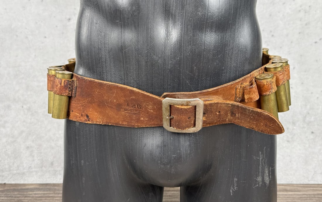 Crocker 12ga Shotgun Belt with Brass Shells: 12 gauge cartridge belt with spent brass shotgun shells. Belt is size 42.