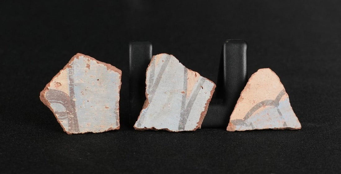 Ancient Egyptian Painted Amarna Pottery Fragments: Largest: 1" by 1". From Tell El Amarna, May 1976. Amarna Period, Reign of Akhenaten, 1353-1335 B.C. Provenance: From the estate of Andrew Cunningham Ware. Andrew Cunningham Ware Collection (1945?2024)