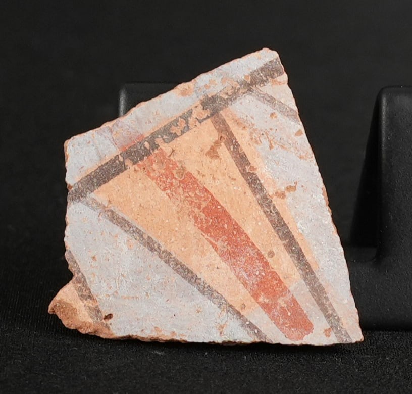 Ancient Egyptian Painted Amarna Pottery Fragment: 1 1/2" by 1 1/2" by 1/4". From Tell El Amarna, May 1976. Amarna Period, Reign of Akhenaten, 1353-1335 B.C. Provenance: From the estate of Andrew Cunningham Ware. Andrew Cunningham Ware Collection (194