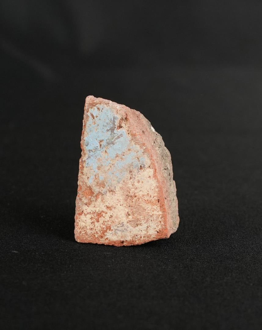 Ancient Egyptian Painted Amarna Pottery Fragment: 1 7/8" by 1 1/4" by 7/8". From Tell El Amarna, May 1976. Amarna Period, Reign of Akhenaten, 1353-1335 B.C. Provenance: From the estate of Andrew Cunningham Ware. Andrew Cunningham Ware Collection (194