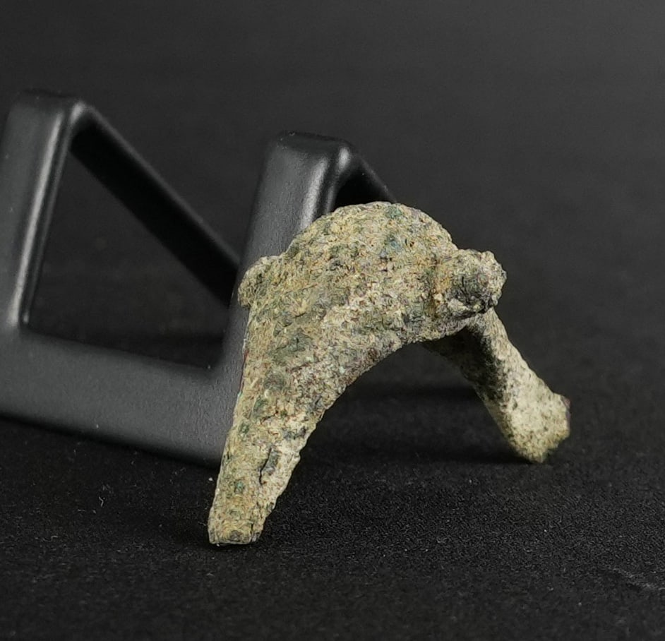 Ancient Etruscan Bronze Fibula Bird Head: 1 7/8" by 1" by 1". Circa 6th Century B.C. Provenance: From the Iris Cornelia Love Collection (1933-2020), New York, primarily formed in the 1950s-1970s. Iris Cornelia Love (1933?2020) was an American