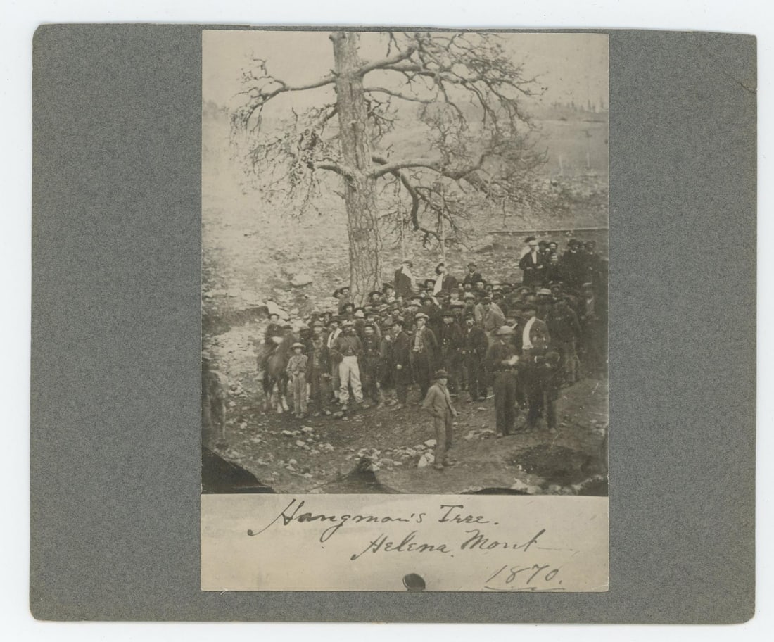 Hangman's Tree Helena Montana Territory Photo: Dated 1870. Image depicts the lynching of Joseph Wilson and Arthur Compton. 5 1/2" by 6 3/4". Was taken from an album. Arthur L. Compton and Joseph Wilson, who had earlier that day been adjudged guilt