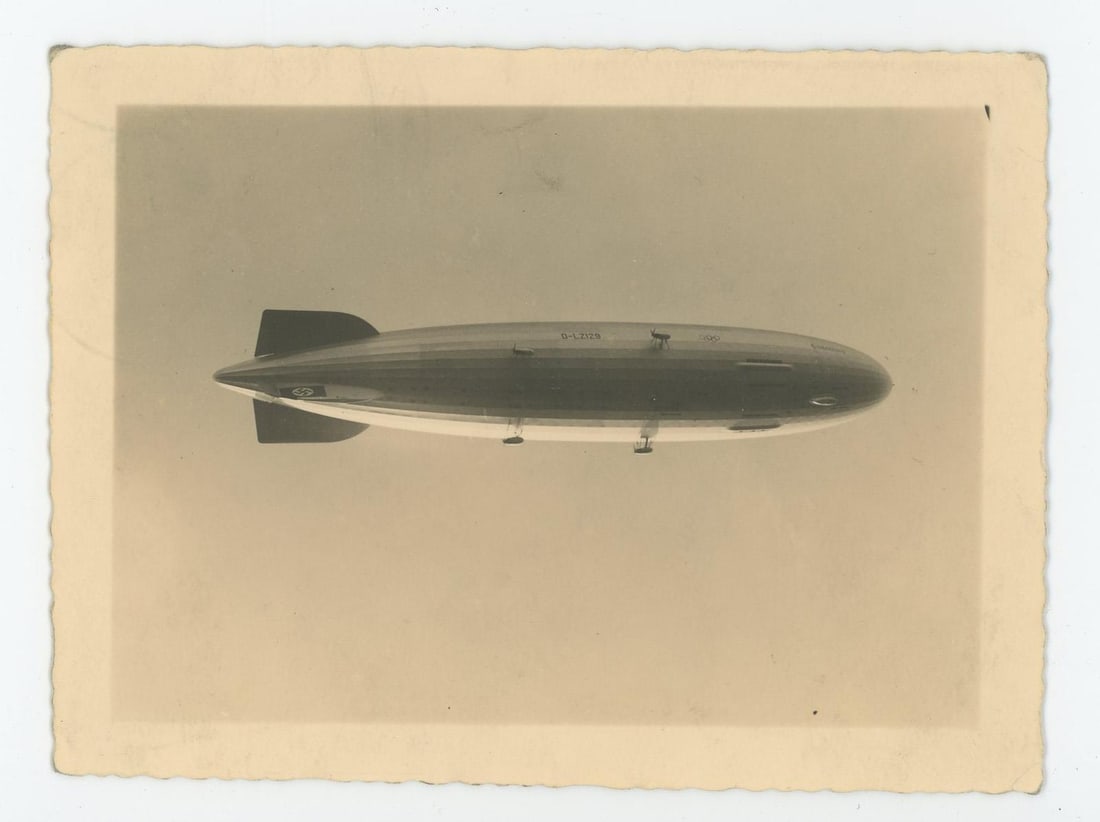 German Hindenburg Zeppelin Olympics Photo: Airship is sporting the Olympic rings on the side. 3 1/2" by 4 3/4" Although the name Hindenburg had been quietly selected by Eckener over a year earlier, only the airship's formal registration