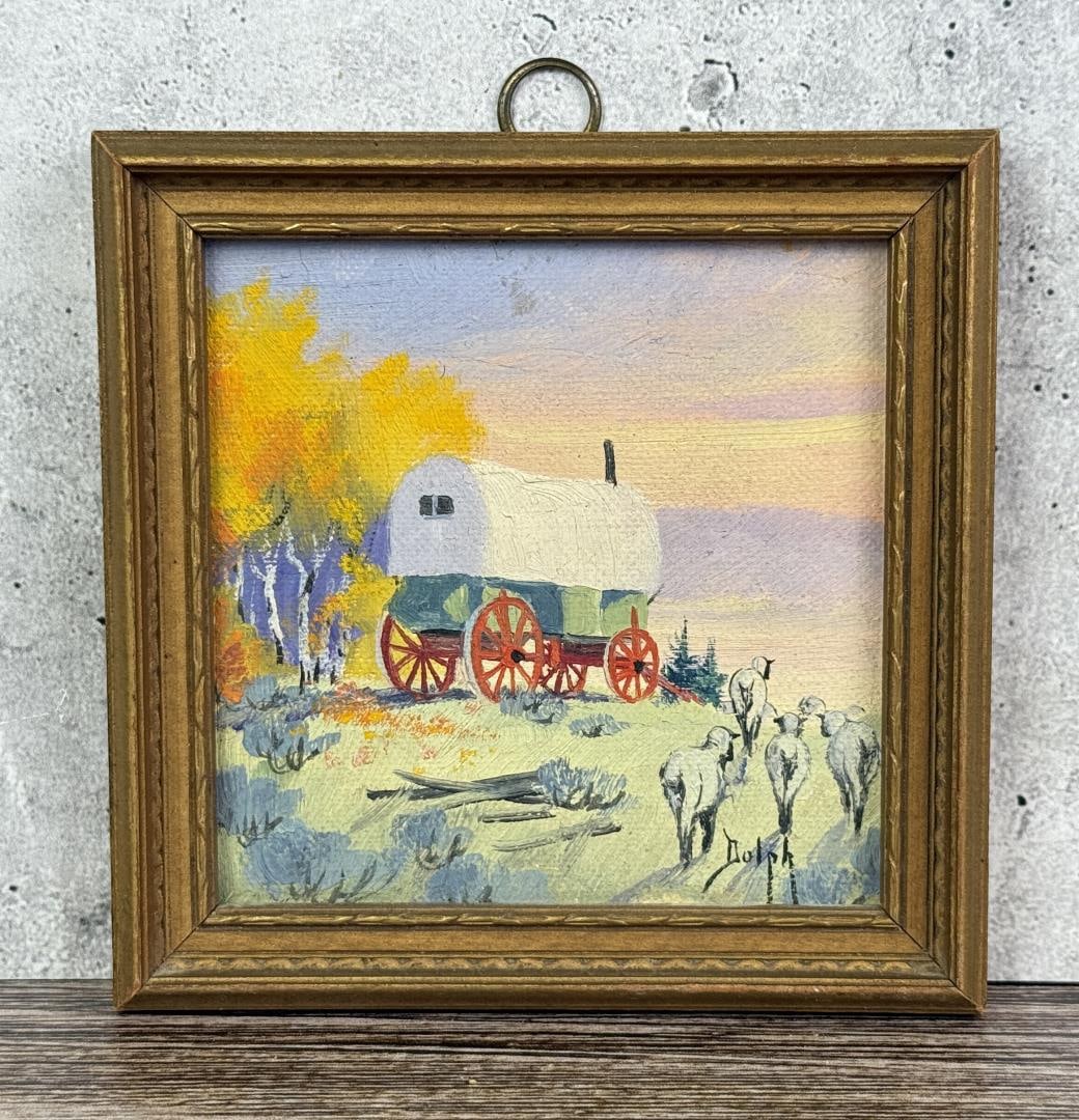 Marie Dorothy Dolph Sheep Wagon Painting: Title is Sheep Wagon. 3 1/4" by 3 1/4" unframed. 4 1/4" by 4 1/4" framed. Oil on Board. Born and raised in Baraboo, Wisconsin, Marie Dorothy Dolph painted until she was age 94, doing canvases of