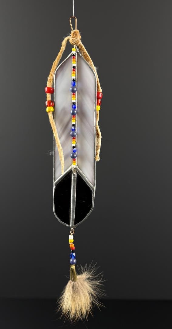 Jay Laber Montana Stained Glass Feather: 11" long. Jay Polite Laber (Born 1962) is active/lives in Montana. Jay Laber is known for Metal sculpture from rusting cars. Jay Polite Laber was born on the Blackfeet Reservation in Montana. Today hi