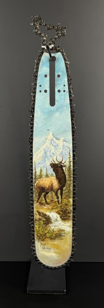 Ann Wildey Painted Chainsaw Blade: Made in Montana. 25" long by 4 3/4" wide.