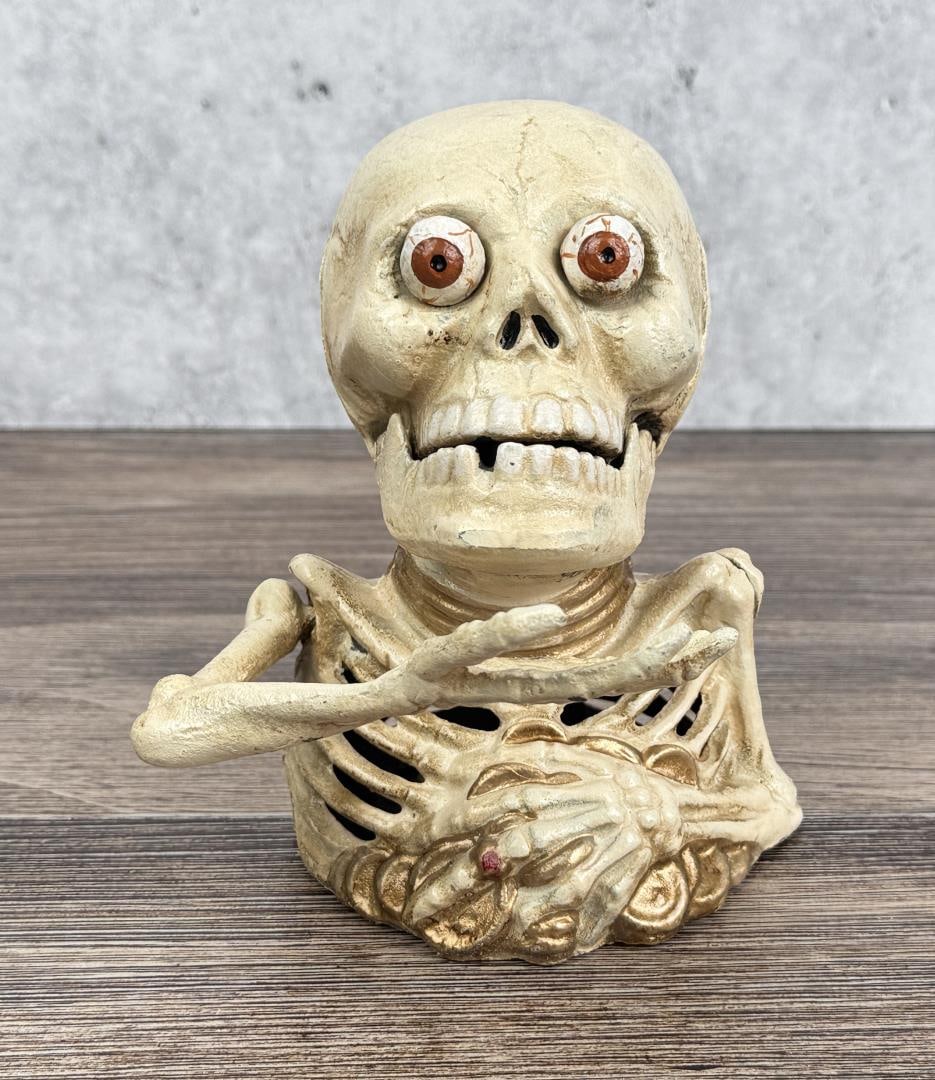 Cast Iron Skeleton Mechanical Bank: 6 3/8" by 6 1/4" by 4 3/4"