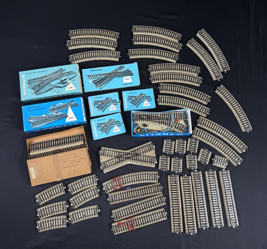 Collection of Marklin HO Scale M Tracks: Nice grouping. Various straight tracks including 5106, curved tracks including 5100 and 5200 series, turnouts/switches 5121, 5114, and a double-slip switch 5128.
