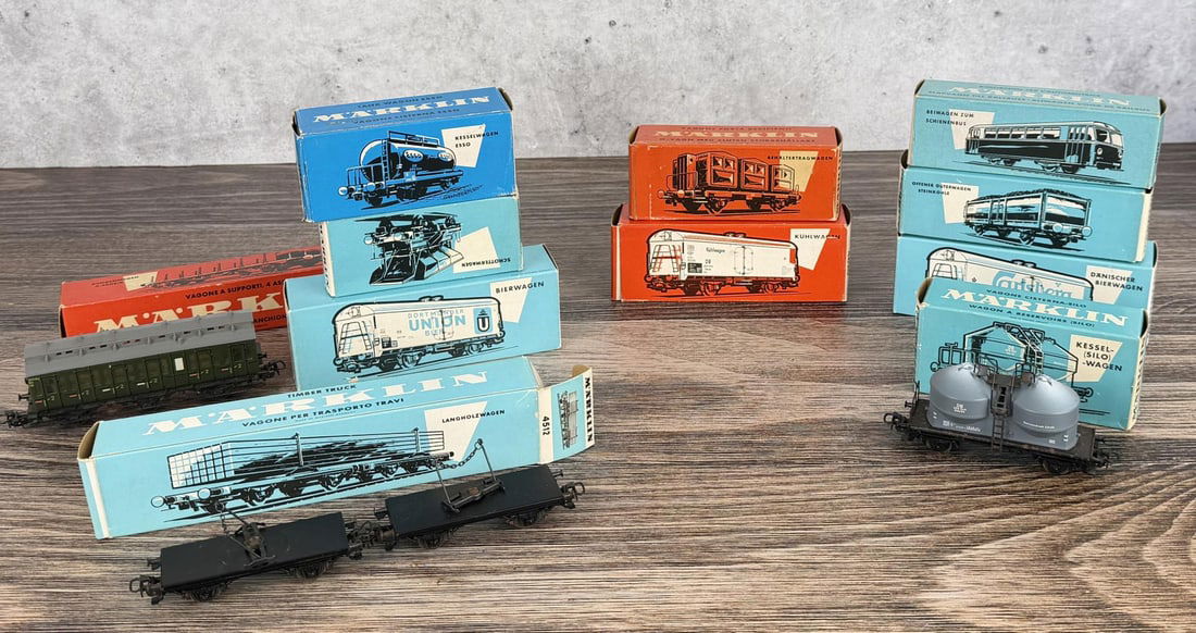 Marklin HO Scale Model Railway Freight Cars: Includes various car types like tank cars or Kesselwagen, and beer cars or Bierwagen.
