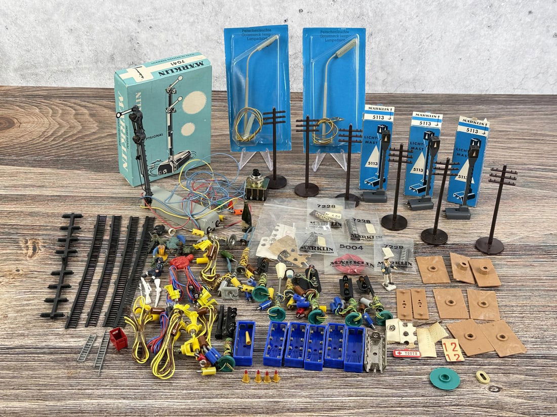 Collection of Marklin Train Accessories: Train poles, tracks wiring and more.