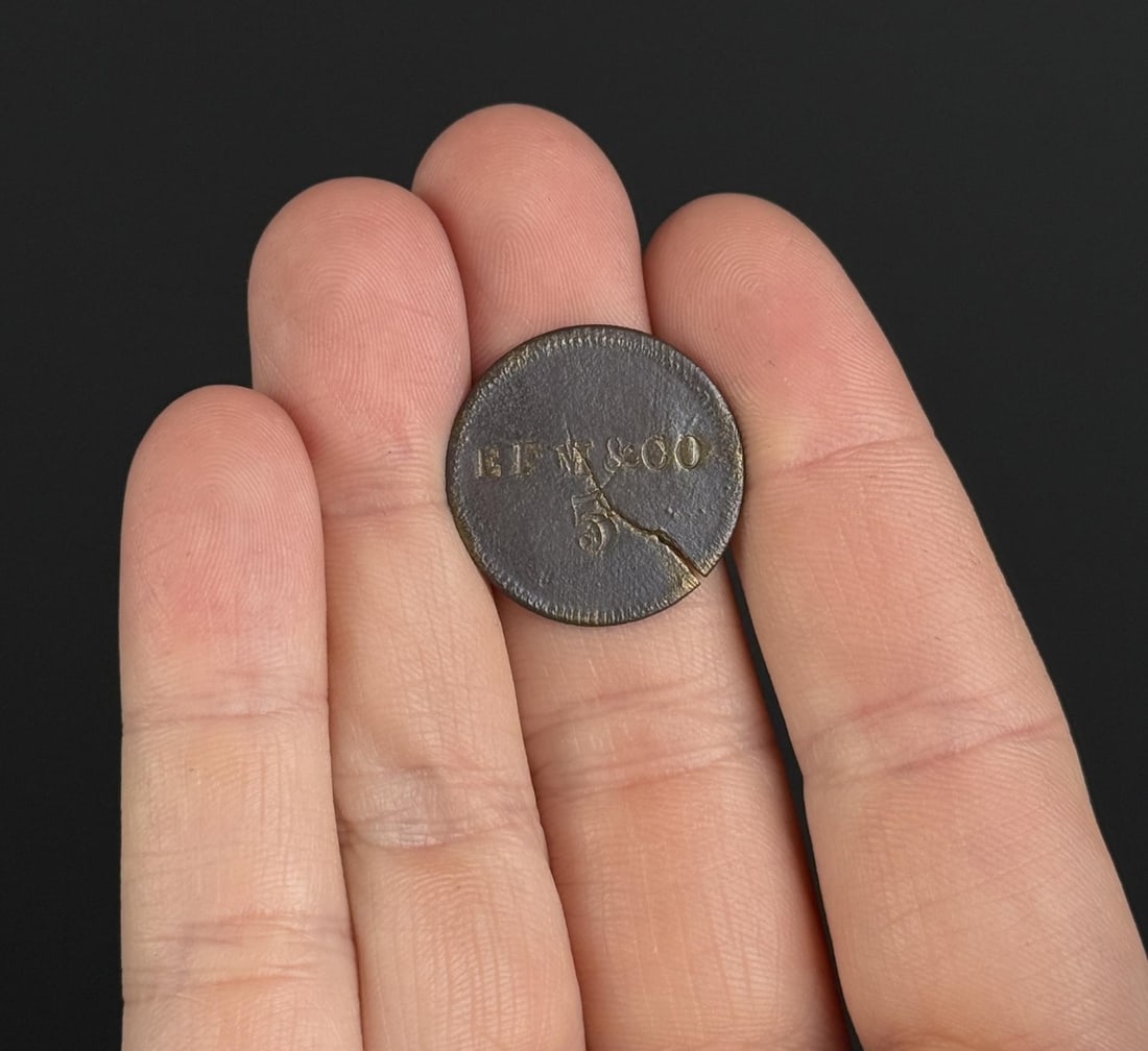 EFM and Co Civil War Token: Store card token issued by the EF Meredith and Company.