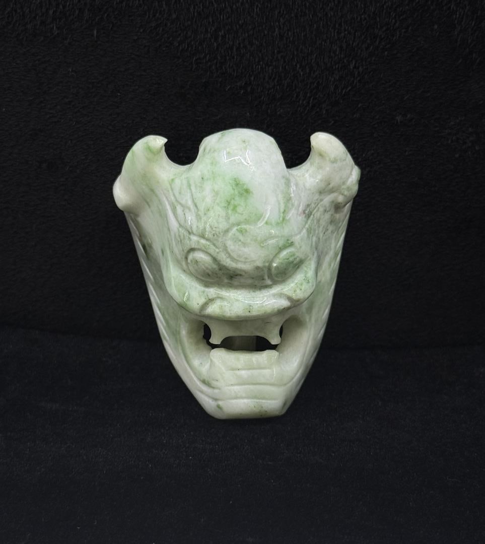 Jade Mask Belt Buckle: 55.20 grams. 1 3/4" by 2 1/8".