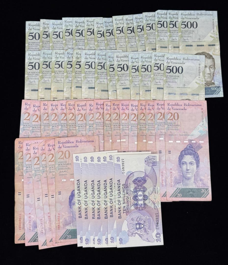 Collection of Foreign Paper Bank Notes: 28 Venezuelan 500 bills, 23 20 bills and 7 Uganda 10 bills.