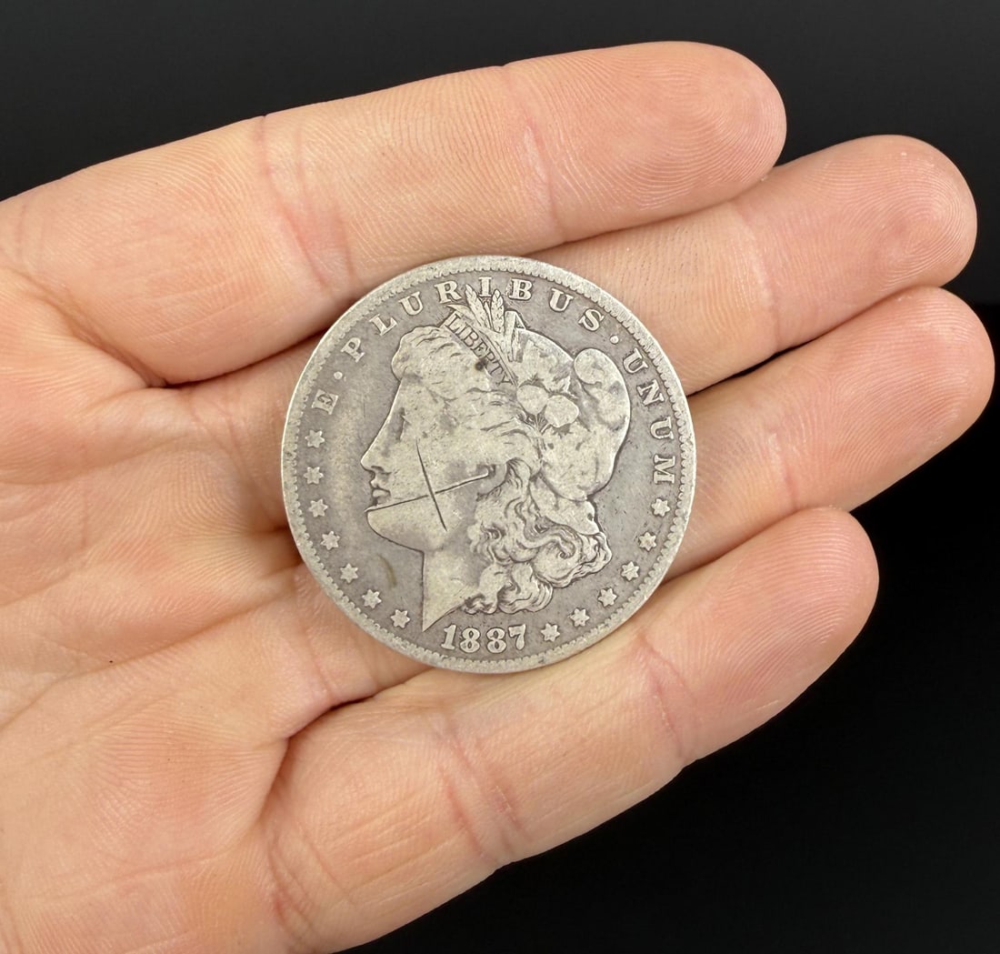 1887 O Morgan Silver Dollar: Scratch on cheek