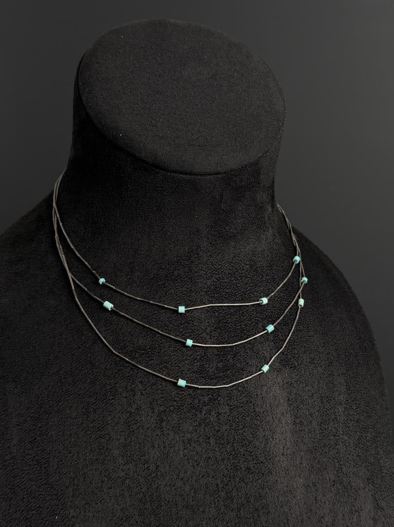 Navajo Liquid Sterling Silver Necklace: 7 1/2" long as displayed. 8.8 grams.