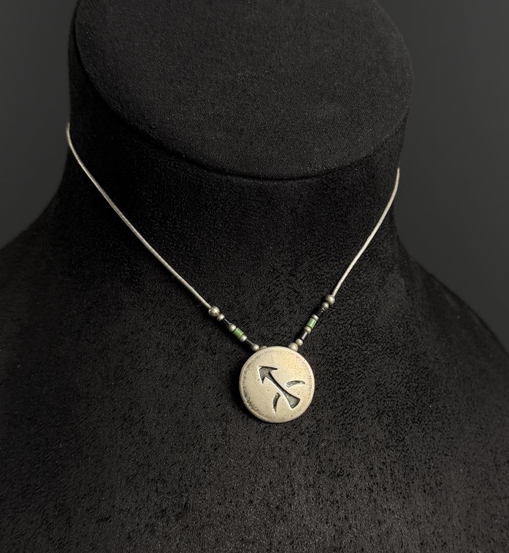 Navajo Sterling Silver Arrow Necklace: 8 grams. 8" long as displayed.