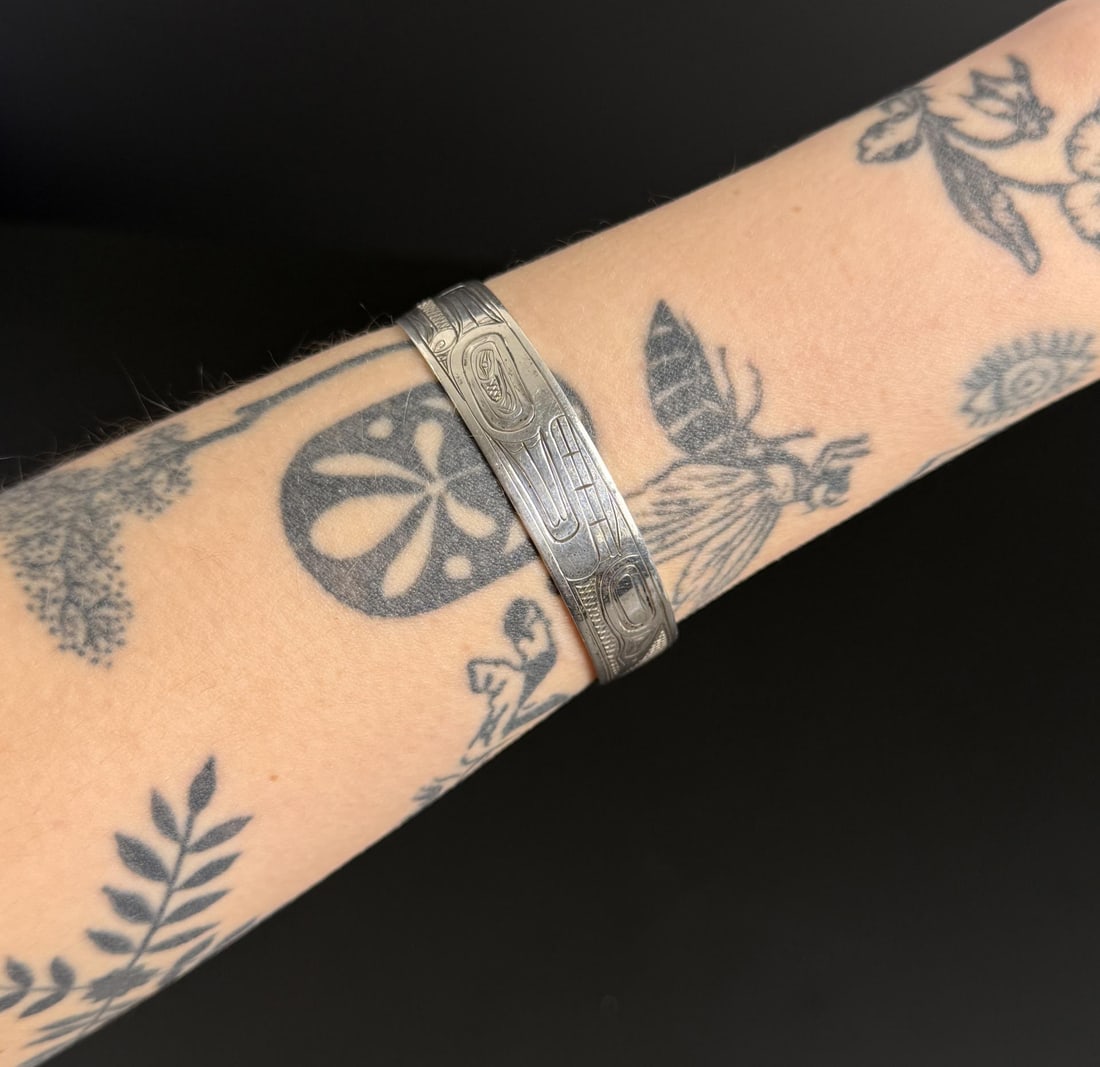 Doug Chilton Tlingit Sterling Silver Bracelet: Killer Whale Pattern. 19.2 grams. 6 1/4" inner circumference.