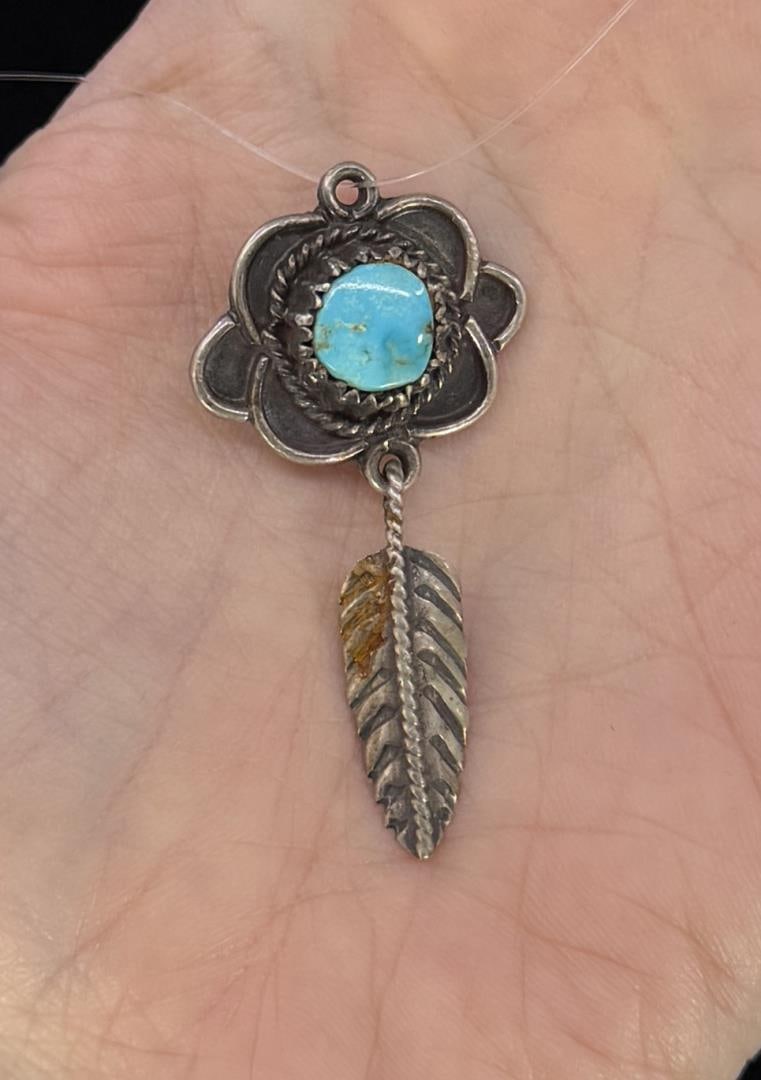 Navajo Sterling Silver Turquoise Pendant: 4.3 grams. 1 3/4" long.