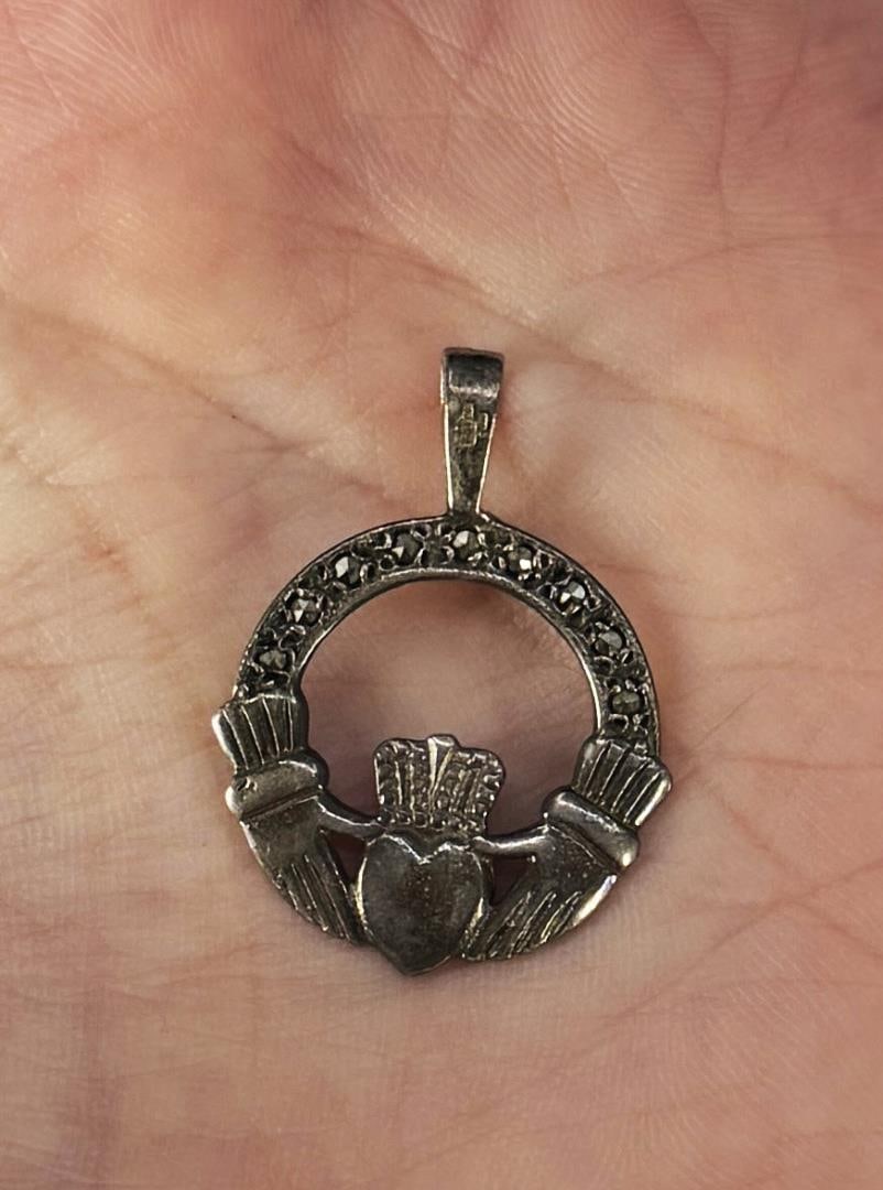 Sterling Silver Marcasite Claddagh Pendant: 2.2 grams. 1" diameter.