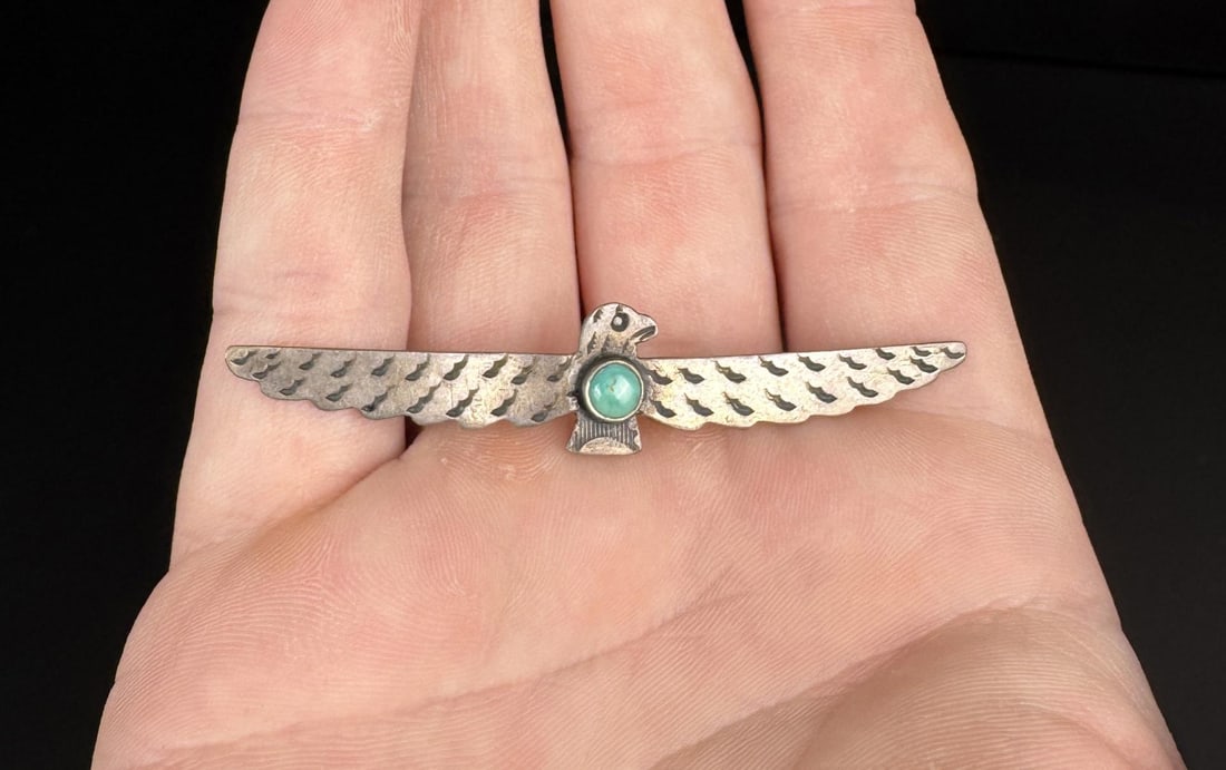 Navajo Sterling Turquoise Thunderbird Brooch: 3/8" by 2 1/2". 3.03 grams