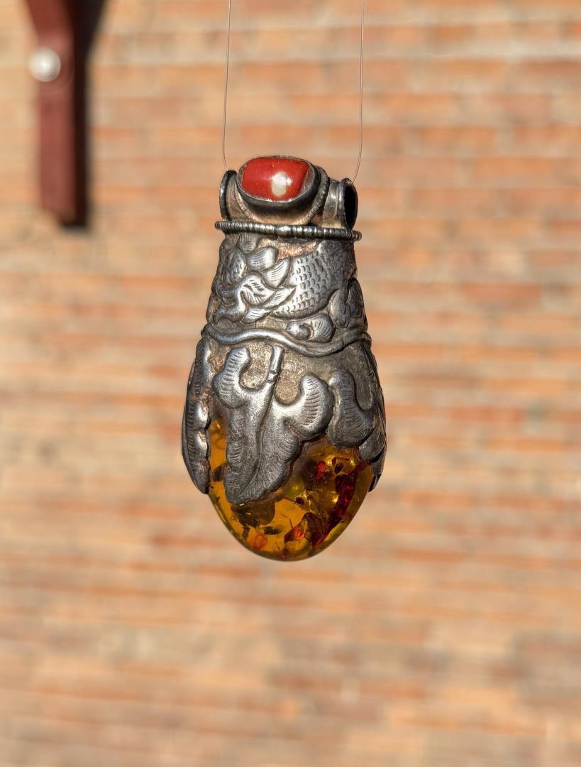 Nepalese Sterling Silver Amber Coral Pendant: 55.3 grams. 2 3/4" by 1 1/4".