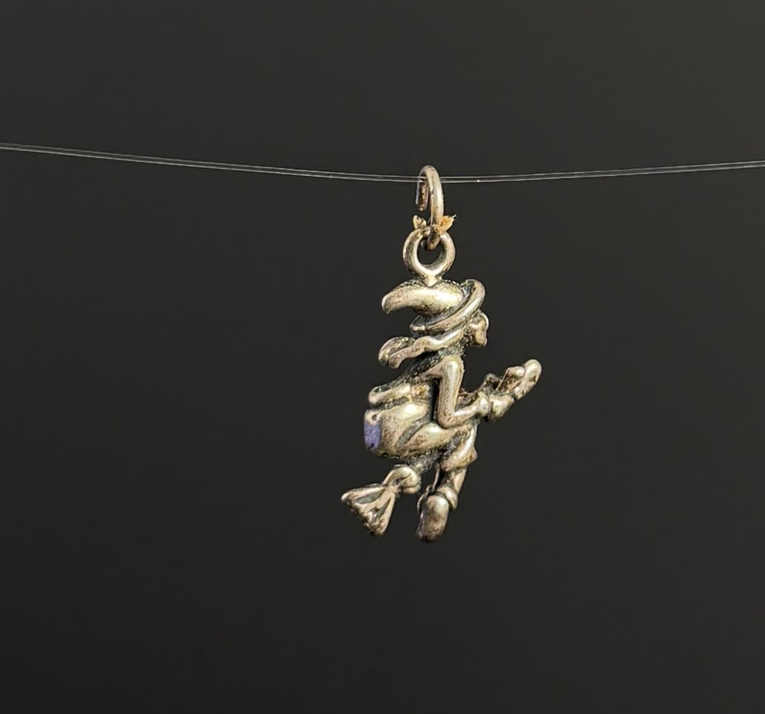 Sterling Silver Halloween Witch Charm: 2.8 grams. 5/8" long.