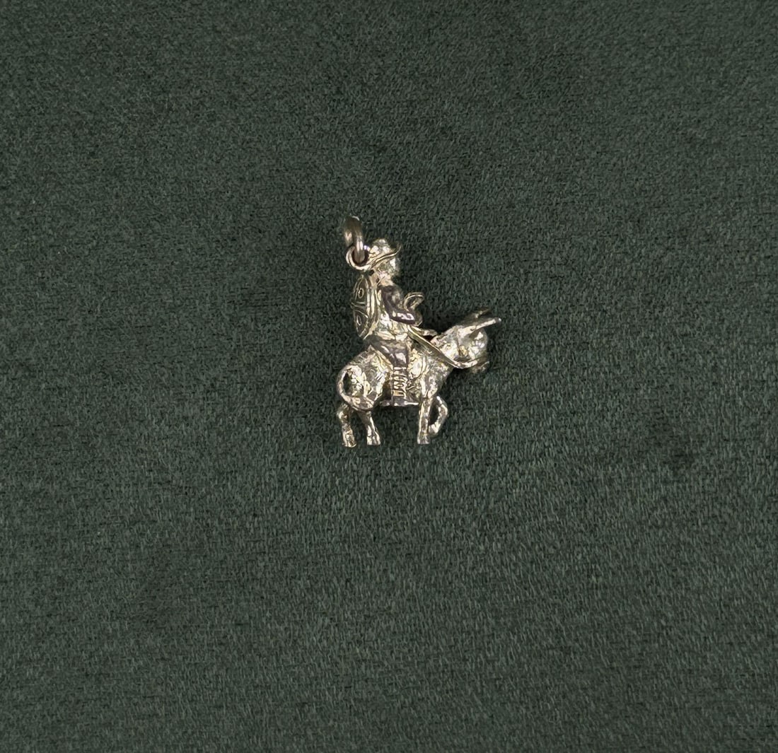 Sterling Silver Knight on Donkey Charm: 3/4" long. 4 grams.
