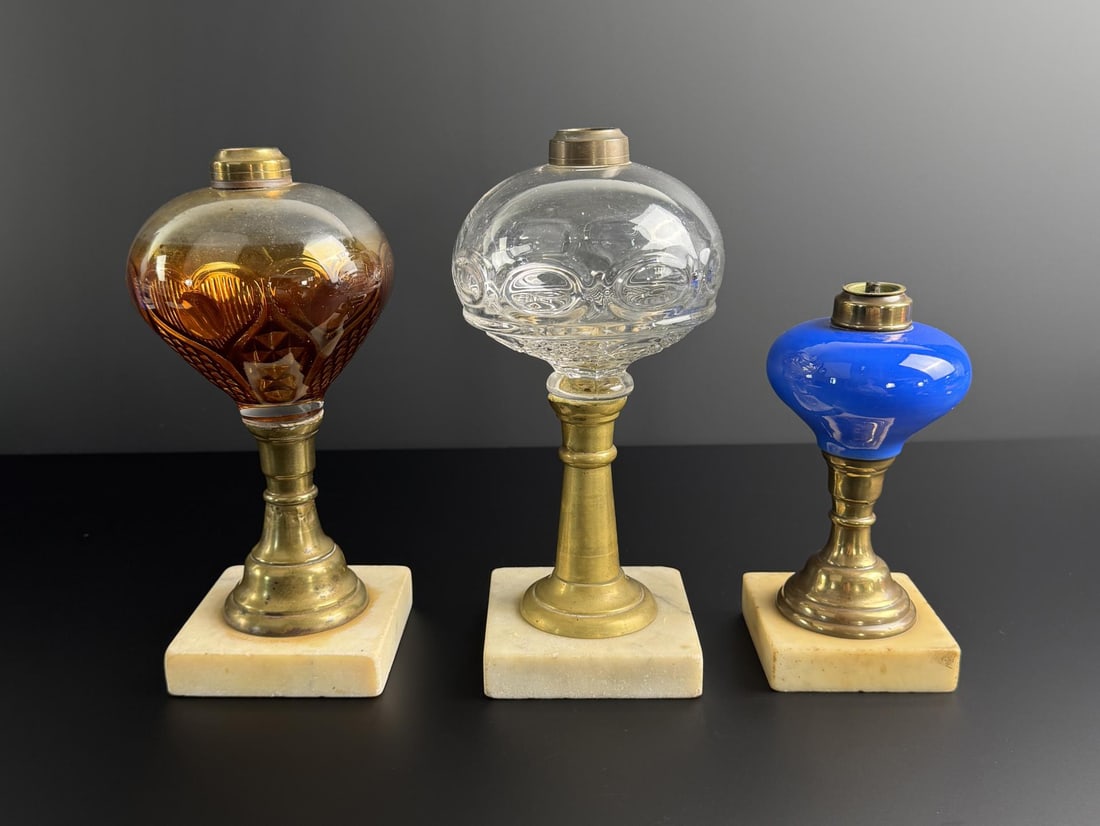 Collection of 19th Century Whale Oil Lamps: Largest is 10" tall. Old bulls eye and heart patterns.