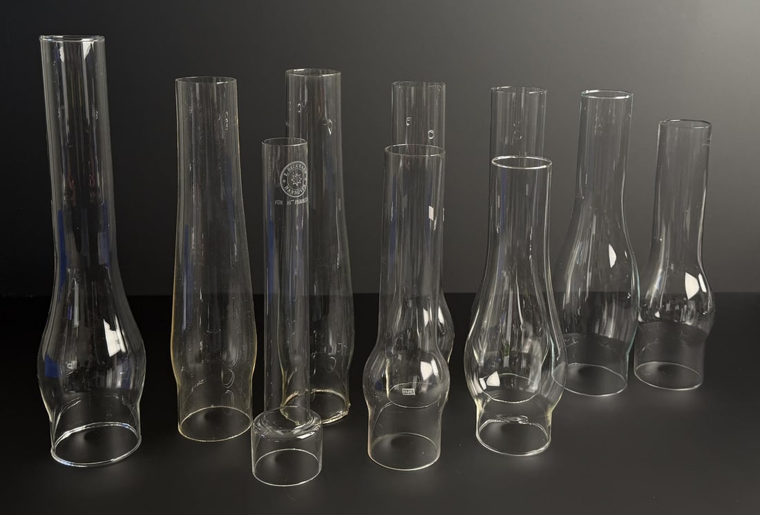 Collection of Oil Lamp Chimneys: One marked E Beckmann. Largest is 14" tall.