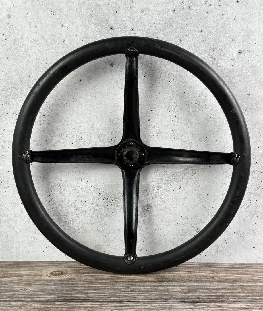 Ford Model T Steering Wheel: 16 7/8" by 16 7/8" by 2 1/4". 1920-1925. Features a 4-spoke configuration with a steel spider.