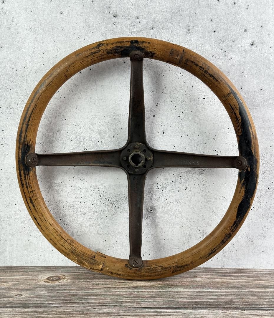 Ford Model T Steering Wheel: 16 1/4" by 16 1/4" by 2 1/4". 4 spoke steering wheel with a wooden rim and a cast iron spider center.