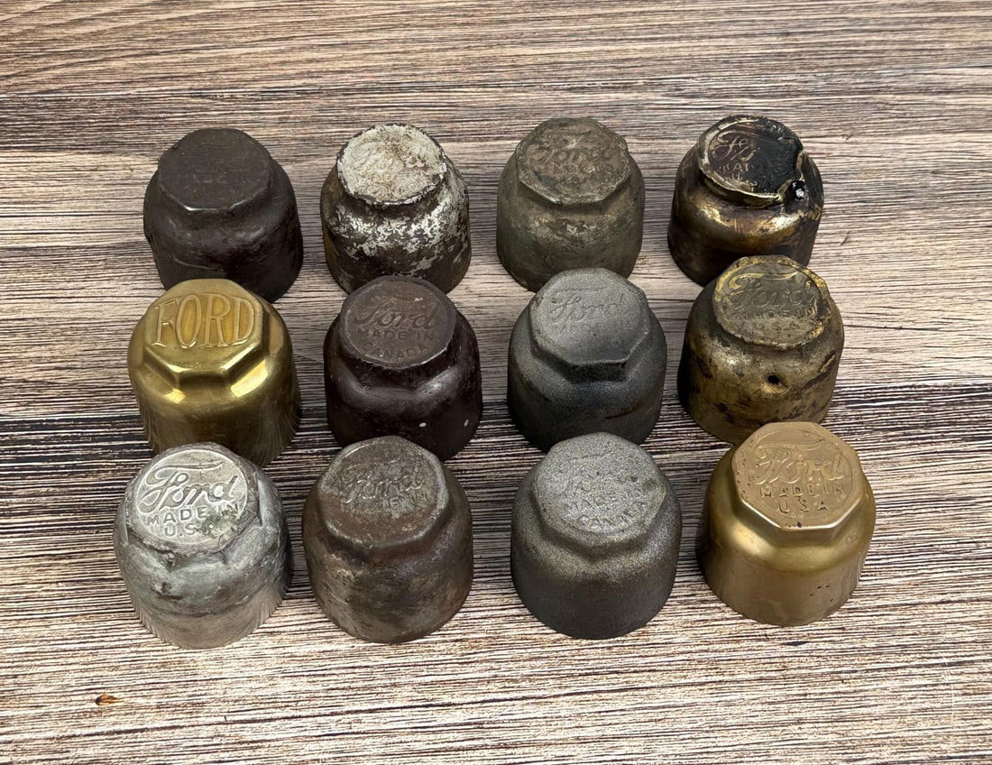 Collection of Ford Model T Grease Cap Hubcaps: Assorted stampings for wood wheeled vehicles.