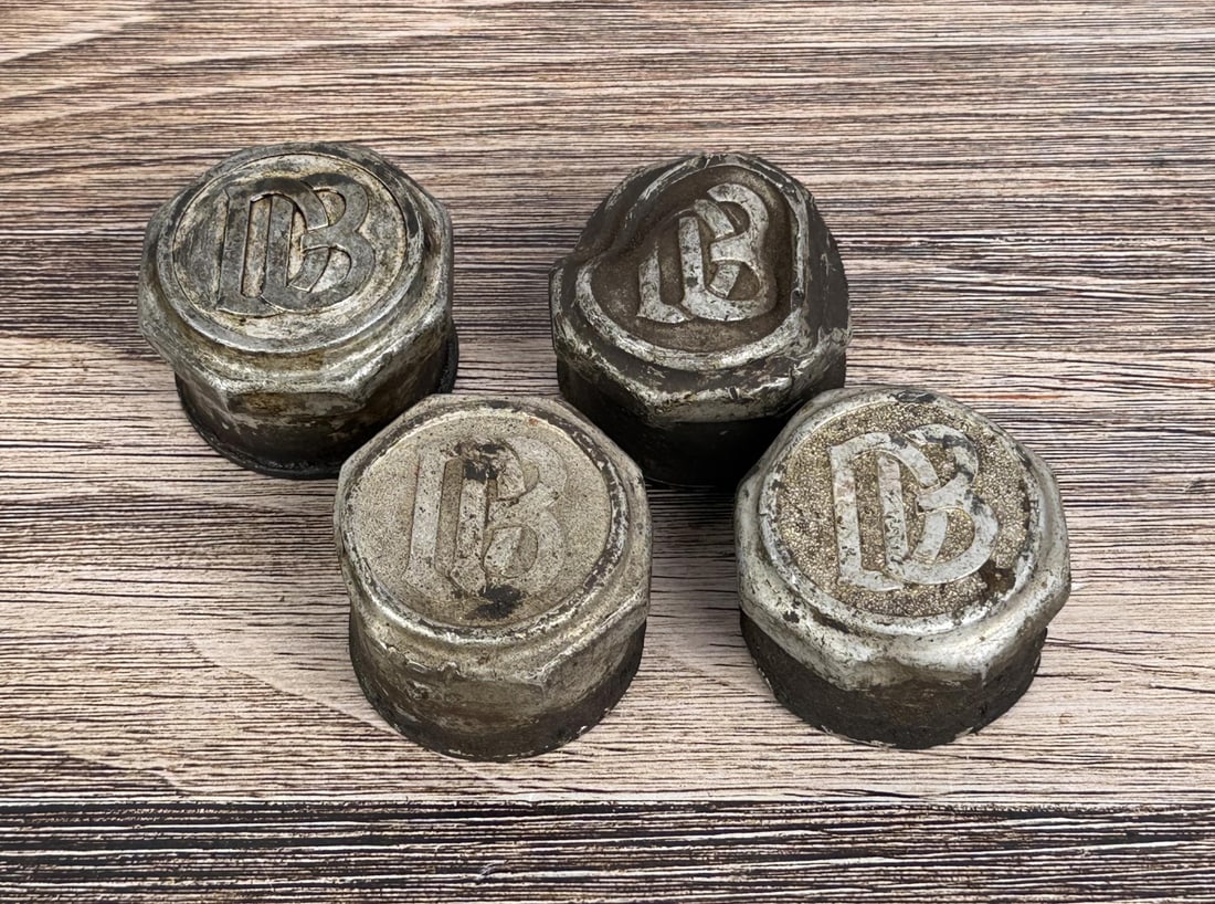 Dodge Brothers Grease Cap Hubcaps: Group of 4.