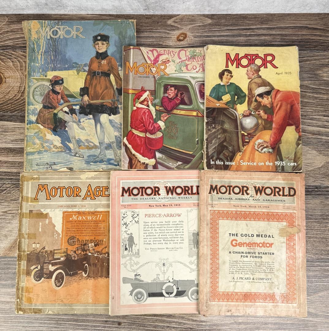 Collection of Motor World Magazines: 1915-1935. They contain historical automotive advertisements, technical service information for early cars, and period-specific artwork.