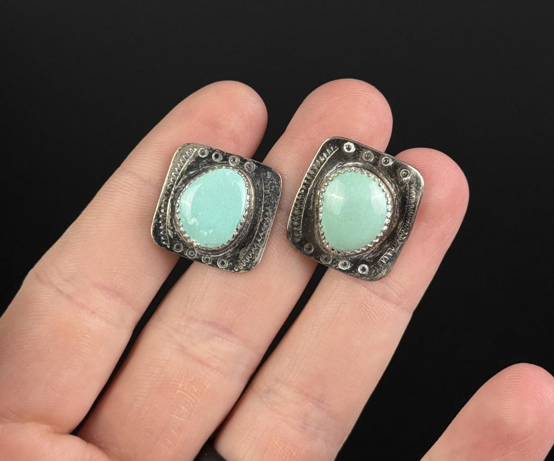 Navajo Sterling Silver Turquoise Cufflinks: One needs a pin replacement as the folding function does not work properly. 11.89 grams.