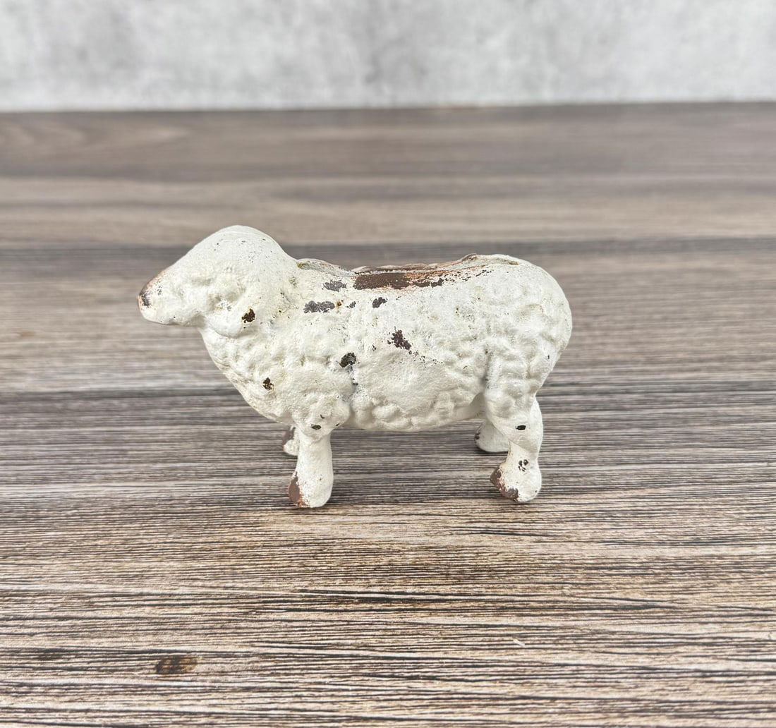 Cast Iron Sheep Still Bank: 4 5/8" by 2 7/8" by 2"