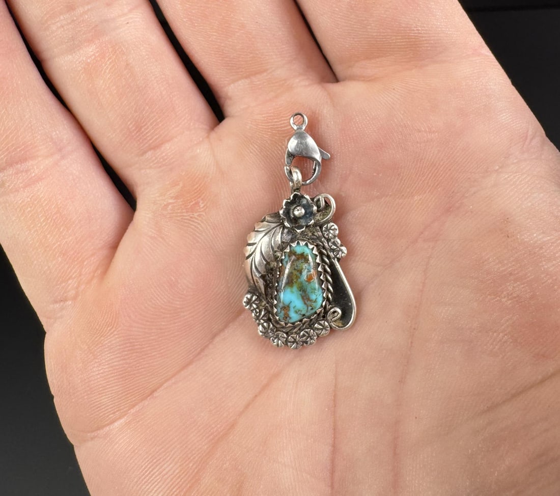 H. Slim Navajo Sterling Silver Turquoise Pendant: 1 1/4" by 1/2". 3.51 grams.