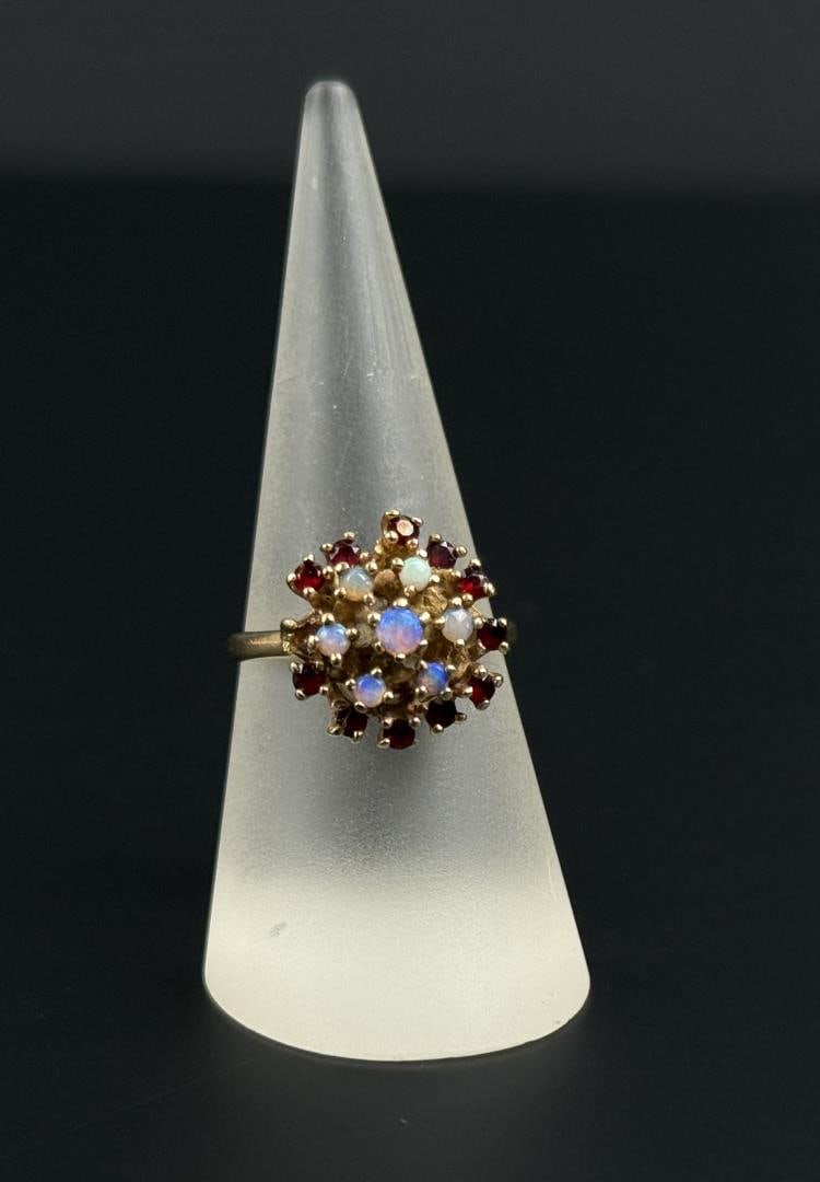 10k Gold Opal and Ruby Cocktail Ring: 4.7 grams. Size 9. Lot requires Payment Via Non Credit Card Only.