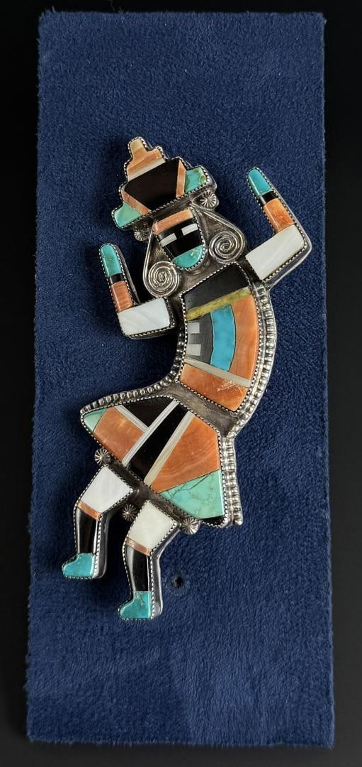 Zuni Sterling Inlaid Rainbow Man Dancer Brooch: 35.74 grams. 3 3/4" long. Attributed to Merle Edaakie.