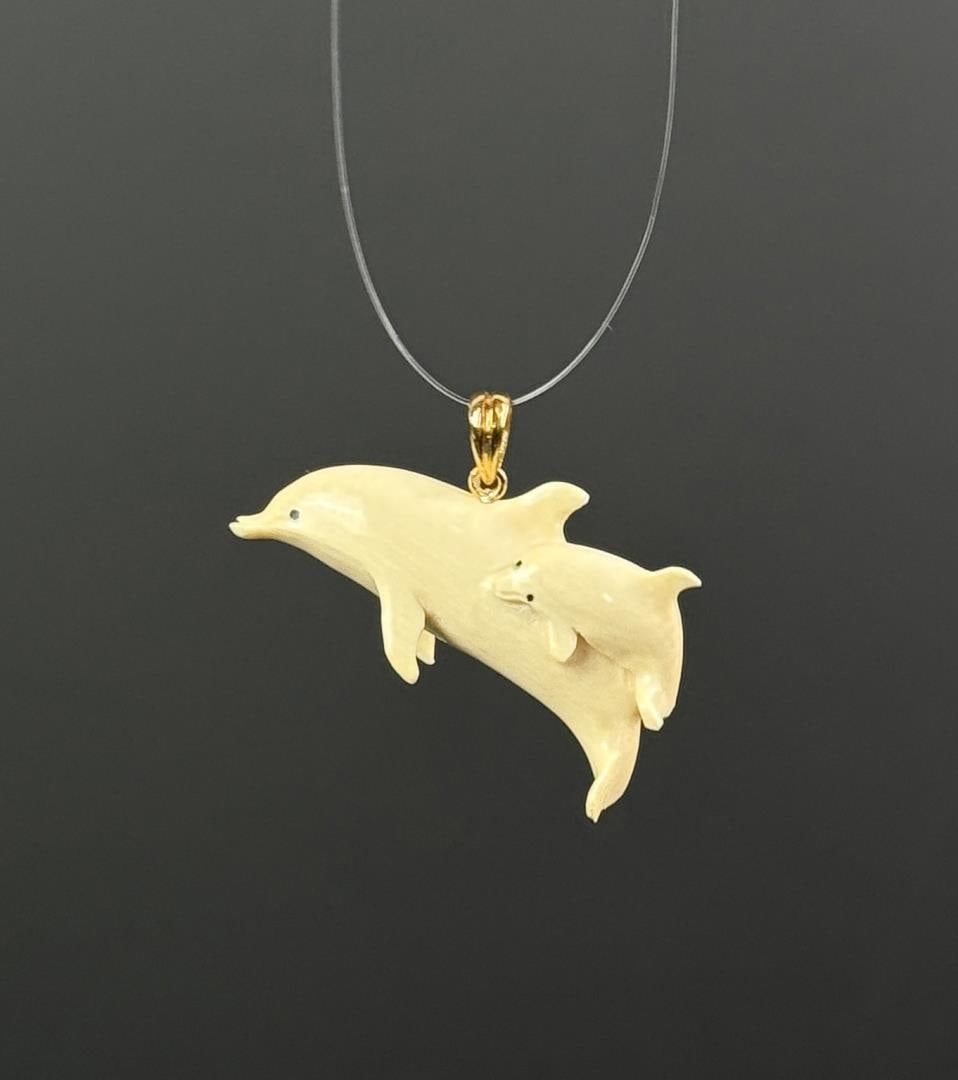 Alaskan Inuit Eskimo Ivory Dolphin Pendant: 1 3/8" by 3/4". Native made prior to 1972. This item cannot be shipped Internationally, or any other state that prohibits.