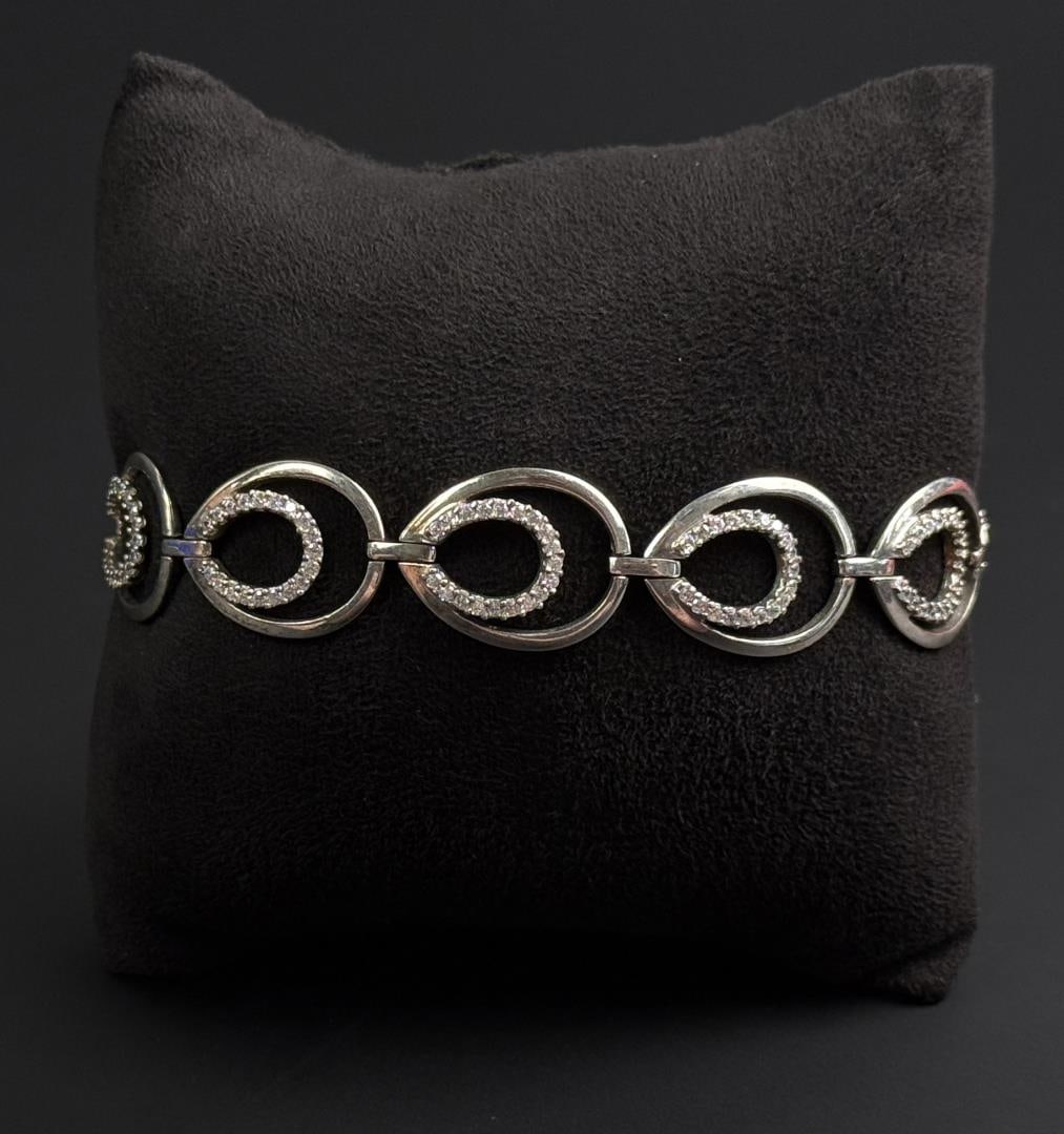 CZ Sterling Silver Bracelet: 15.56 grams. 6 5/8" long open.