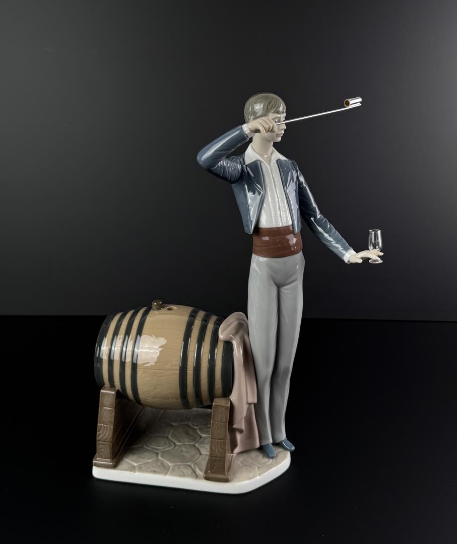 Lladro 5239 Wine Taster Porcelain Figurine: 14" by 10 1/4" by 4 3/4".