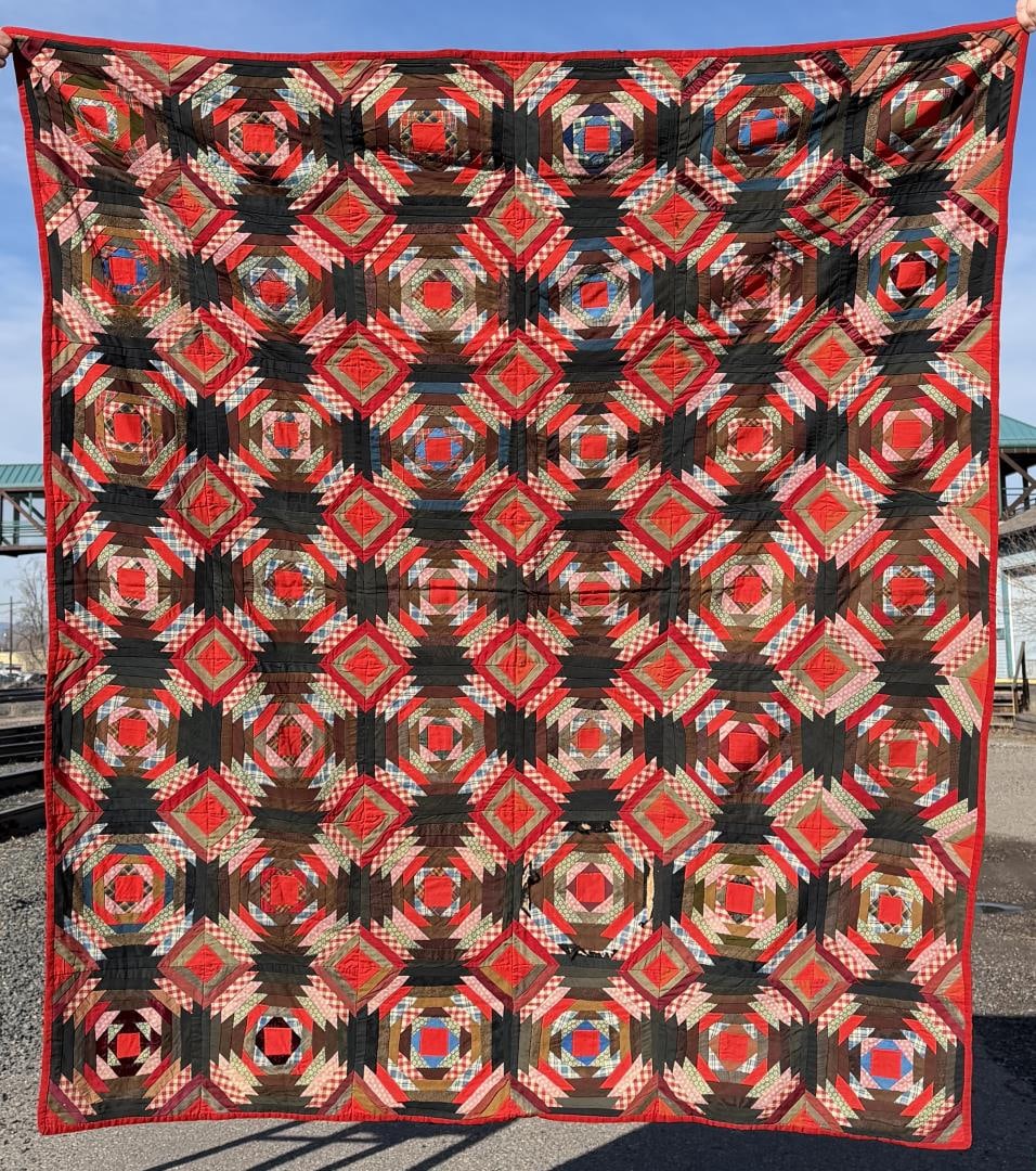 1870s Pennsylvania Log Cabin Pineapple Quilt: 67 1/2" by 79 1/2".