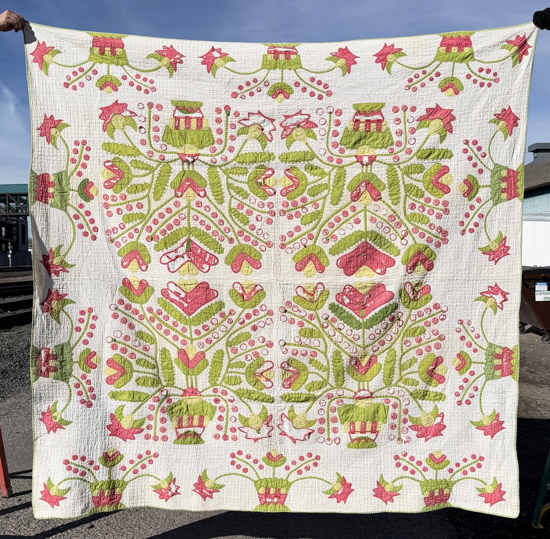 1860s Pennsylvania Flower Urn Pot Red Green Quilt: 83 1/2" by 82". A similar example is documented in the Quilt Index and is attributed to Iva Walker Kurtz (1866-1950).