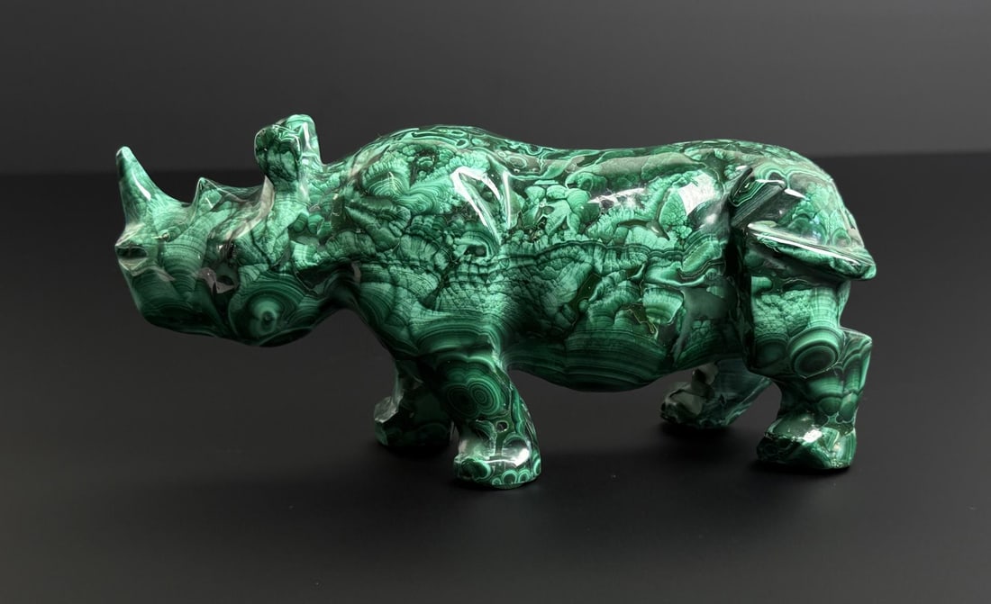 African Malachite Rhino Carving: 7 7/8" by 3 5/8" by 2 1/4". 1646 grams.