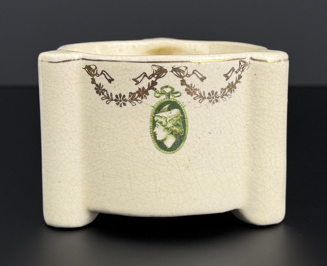 Roseville Cream Medallion Pottery Planter: 4 1/4" by 4" by 2 7/8". Cracked.