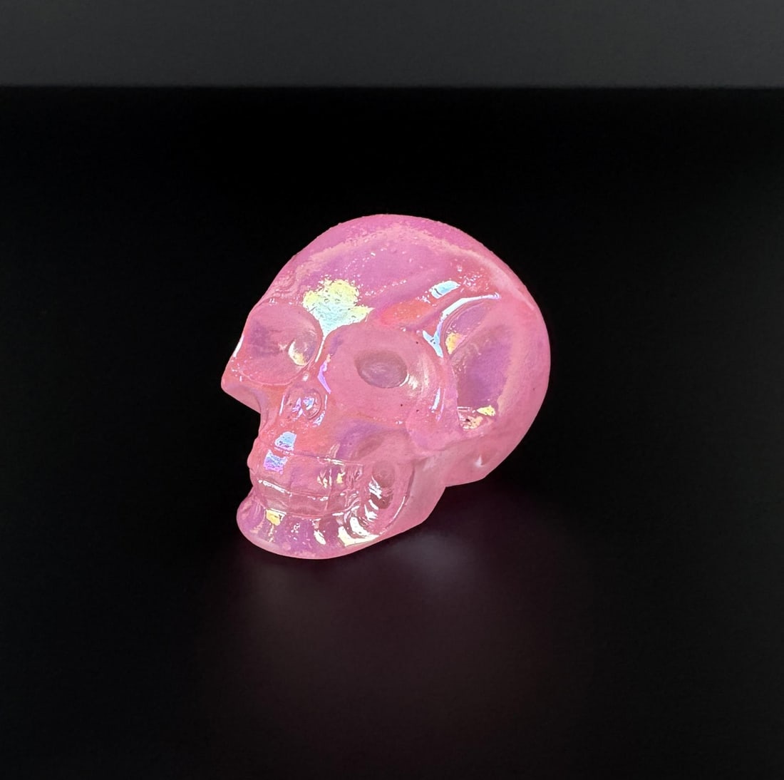 Aura Quartz Skull Carving: 1 3/4" by 1 3/8" by 1 1/4". 82.97 grams.