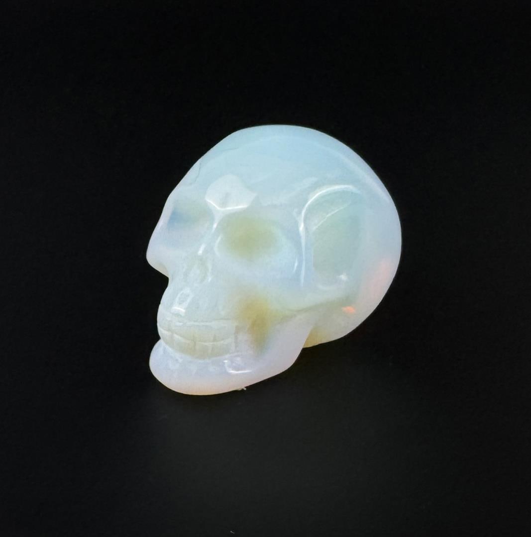 Opalite Skull Carving: 1 7/8" by 1 1/4" by 1 1/4". 81.2 grams.
